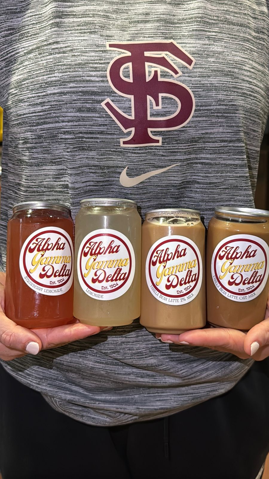 Four canned lattes with custom Alpha Gamma Delta labels