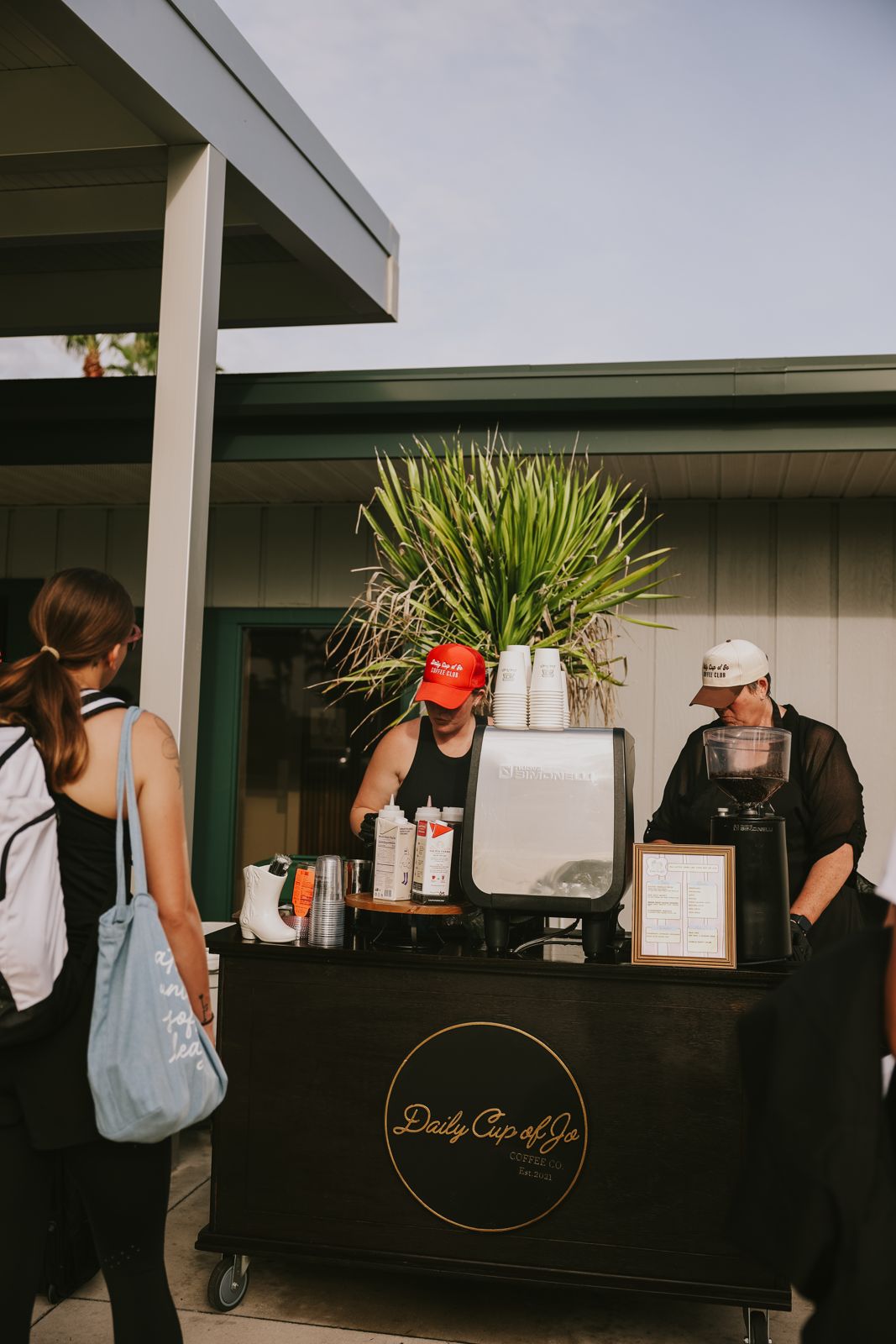 A customer ordering at the Daily Cup of Jo cart